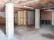Unfinished basement with concrete pillars, floors, and exposed wooden beams on the ceiling at 5736 116Th N Ave, Pinellas Park, FL 33782