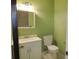 Bathroom featuring a white vanity with sink and a standard toilet at 5736 116Th N Ave, Pinellas Park, FL 33782