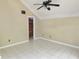 Bedroom with tile floors, neutral paint, ceiling fan, and vaulted ceiling at 5736 116Th N Ave, Pinellas Park, FL 33782