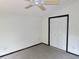 Bedroom featuring white walls, a ceiling fan, and a closet with louvered doors at 5736 116Th N Ave, Pinellas Park, FL 33782