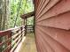 Exterior view of a wooden porch with wood siding and green foliage at 5736 116Th N Ave, Pinellas Park, FL 33782