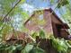 Exterior angle of a multi-story wood home surrounded by lush bamboo plants at 5736 116Th N Ave, Pinellas Park, FL 33782