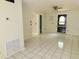 Bright living room featuring tile floors, neutral walls, and a ceiling fan at 5736 116Th N Ave, Pinellas Park, FL 33782