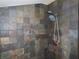 Shower featuring a hand-held shower head, and a stylish multi-color tile surround at 5736 116Th N Ave, Pinellas Park, FL 33782