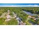 Beautiful aerial view of homes near the lake, with lush greenery and a serene waterfront setting at 5808 Silver Moon Ave, Tampa, FL 33625