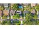 Overhead aerial view of the property, showing solar panels, a screened porch, and surrounding neighborhood at 5808 Silver Moon Ave, Tampa, FL 33625