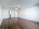 This spacious bedroom includes hardwood floors, ceiling fan, and entrance to the bathroom at 5808 Silver Moon Ave, Tampa, FL 33625