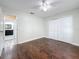 A bright bedroom features hardwood floors, a closet, and a doorway to the bathroom at 5808 Silver Moon Ave, Tampa, FL 33625