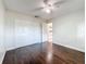 Bedroom featuring laminate flooring and a closet with double doors, featuring a ceiling fan at 5808 Silver Moon Ave, Tampa, FL 33625
