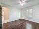 Bedroom showcasing laminate flooring and a window, featuring a ceiling fan at 5808 Silver Moon Ave, Tampa, FL 33625