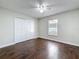 Bedroom showcasing laminate flooring, closet with double doors, and a window at 5808 Silver Moon Ave, Tampa, FL 33625