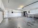 Spacious garage with ample storage cabinets and a functional workspace at 5808 Silver Moon Ave, Tampa, FL 33625