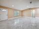 Bright and spacious living room featuring tile floors, recessed lighting and neutral colored walls at 5808 Silver Moon Ave, Tampa, FL 33625