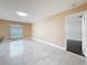 Open living area offers neutral paint and tile floors, illuminated by recessed lighting and natural light at 5808 Silver Moon Ave, Tampa, FL 33625