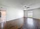 Spacious living room features dark wood floors, neutral paint, and a ceiling fan at 5808 Silver Moon Ave, Tampa, FL 33625