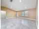 Bright and spacious living room featuring tile floors, recessed lighting and neutral colored walls at 5808 Silver Moon Ave, Tampa, FL 33625