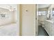 Well-lit bathroom featuring white vanity and sink with ceramic tile floors, located next to the bedroom at 5825 Oakhurst Dr, Seminole, FL 33772