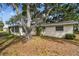 Charming home featuring mature trees and a well-maintained lawn at 5825 Oakhurst Dr, Seminole, FL 33772