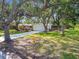 Lovely single-Gathering home with mature trees, green lawn, and a paved driveway, situated in a desirable neighborhood at 5825 Oakhurst Dr, Seminole, FL 33772