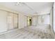 Spacious living room with sliding glass doors, neutral walls and plush carpeting at 5825 Oakhurst Dr, Seminole, FL 33772