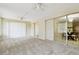 Living room with carpet and a view to dining room with a decorative chandelier at 5825 Oakhurst Dr, Seminole, FL 33772