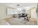 Well-lit living room with neutral tones, contemporary furnishings, and large windows, perfect for relaxation at 5825 Oakhurst Dr, Seminole, FL 33772