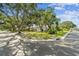 Charming single-story house on a corner lot with lush landscaping and a well-maintained lawn in a tranquil neighborhood at 5825 Oakhurst Dr, Seminole, FL 33772