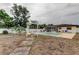 Spacious backyard featuring a pool and a pergola, ideal for relaxation and outdoor activities at 6409 41St N Ave, St Petersburg, FL 33709