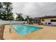 Large backyard with a pool, patio, and a sunroom for outdoor enjoyment at 6409 41St N Ave, St Petersburg, FL 33709