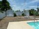 A storage shed, swimming pool, arbor and a privacy fence are features of the backyard at 6409 41St N Ave, St Petersburg, FL 33709