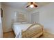 Inviting bedroom with a queen-size bed, ceiling fan, and lots of natural light at 6409 41St N Ave, St Petersburg, FL 33709
