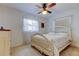 Inviting bedroom with a queen-size bed, ceiling fan, and lots of natural light at 6409 41St N Ave, St Petersburg, FL 33709