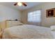 Inviting bedroom with a queen-size bed, ceiling fan, and lots of natural light at 6409 41St N Ave, St Petersburg, FL 33709