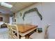 Dining area featuring a wood table with white frame, seating for six, and natural light at 6409 41St N Ave, St Petersburg, FL 33709