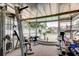 Home gym featuring workout machines and a view of the sparkling pool at 6409 41St N Ave, St Petersburg, FL 33709