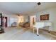 Open-concept living space with a piano and comfortable seating at 6409 41St N Ave, St Petersburg, FL 33709