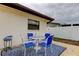 Charming patio area with a table and chairs, perfect for outdoor dining and relaxation at 6409 41St N Ave, St Petersburg, FL 33709
