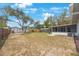 Large fenced-in backyard with enclosed outdoor patio at 6639 Winding Oak Dr, Tampa, FL 33625
