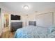 This bedroom features a bed, wooden floors, and an ensuite bathroom at 6639 Winding Oak Dr, Tampa, FL 33625