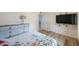 Bright bedroom with wood floors, closet, and ensuite bathroom at 6639 Winding Oak Dr, Tampa, FL 33625