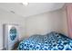 This bedroom features wood floors and mirrored armoire at 6639 Winding Oak Dr, Tampa, FL 33625