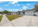 Well-maintained home with a spacious driveway and manicured lawn at 6639 Winding Oak Dr, Tampa, FL 33625