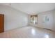 Bright living room featuring tile floors, a window, and an elegant front door at 6639 Winding Oak Dr, Tampa, FL 33625