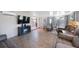 The living room features a TV, table with chairs, tile floors, and comfortable seating at 6639 Winding Oak Dr, Tampa, FL 33625
