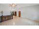 Large living room featuring tile floors, vaulted ceilings, and wood furnishings at 6639 Winding Oak Dr, Tampa, FL 33625