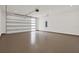 Clean garage with epoxy floor, recessed lights, and modern garage door at 710 W Plymouth St, Tampa, FL 33603