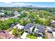 Aerial view of the luxury home in a neighborhood with the city skyline in the distance at 710 W Plymouth St, Tampa, FL 33603