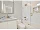 Modern bathroom with subway tile shower, marble countertop, and brushed gold fixtures at 710 W Plymouth St, Tampa, FL 33603