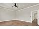 Spacious bedroom featuring hardwood floors, a modern ceiling fan, and recessed lighting at 710 W Plymouth St, Tampa, FL 33603