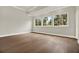 Large bedroom with hardwood floors, tray ceiling, and ample natural light at 710 W Plymouth St, Tampa, FL 33603